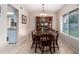 Dining room with ceramic tile, featuring chandelier, a large wooden table, and china cabinet at 15424 N 52Nd Pl, Scottsdale, AZ 85254