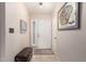 Inviting entryway featuring tile floors, a coat rack, and art decorations, creating a warm welcome at 15424 N 52Nd Pl, Scottsdale, AZ 85254