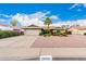 Charming single-story home with a well-maintained front yard and a two-car garage at 15424 N 52Nd Pl, Scottsdale, AZ 85254