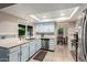 Charming kitchen with stainless steel dishwasher, sink and tile backsplash at 15424 N 52Nd Pl, Scottsdale, AZ 85254