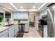 Open kitchen with stainless steel appliances and natural light at 15424 N 52Nd Pl, Scottsdale, AZ 85254