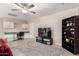 Open concept living room featuring ceiling fan, office nook, and TV at 15424 N 52Nd Pl, Scottsdale, AZ 85254