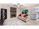 Inviting living room with stone fireplace and access to the yard through sliding glass door at 15424 N 52Nd Pl, Scottsdale, AZ 85254