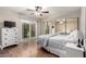 Bright bedroom with a large closet, a sliding glass door and hard wood floors at 15424 N 52Nd Pl, Scottsdale, AZ 85254