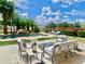 Backyard area with a pool, lounge chairs, and a fire pit at 15602 N 37Th St, Phoenix, AZ 85032