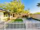 Private backyard with a patio, artificial turf, and mature trees, ideal for outdoor living at 15602 N 37Th St, Phoenix, AZ 85032
