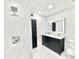 Modern bathroom with dual sinks, lighted mirror, stylish fixtures and white tiling at 15602 N 37Th St, Phoenix, AZ 85032