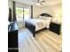 Cozy bedroom with a large window, neutral colors, and ceiling fan at 15602 N 37Th St, Phoenix, AZ 85032