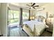 Serene bedroom featuring elegant furnishings, soft lighting, and easy access to the outdoors at 15602 N 37Th St, Phoenix, AZ 85032