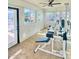 Bright home gym featuring modern exercise equipment and ample natural light and exterior access at 15602 N 37Th St, Phoenix, AZ 85032