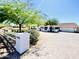 Charming home exterior featuring a well-manicured lawn, mature trees, and a lovely driveway at 15602 N 37Th St, Phoenix, AZ 85032