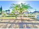 Beautiful home exterior featuring a white fence, lush greenery, and mature trees at 15602 N 37Th St, Phoenix, AZ 85032