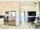 Bright kitchen with stainless steel appliances that opens into the cozy living room at 15602 N 37Th St, Phoenix, AZ 85032