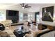 Open living room with fireplace, large windows, contemporary decor and open plan dining at 15602 N 37Th St, Phoenix, AZ 85032