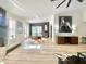 Bright living room showcasing the decor, wood floors, and black accent wall at 15602 N 37Th St, Phoenix, AZ 85032