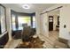 Home office with large windows, a desk, and a sliding barn door for added privacy at 15602 N 37Th St, Phoenix, AZ 85032
