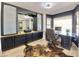 Home office featuring black built-in cabinets, a desk, and a cowhide rug on light, neutral-toned floors at 15602 N 37Th St, Phoenix, AZ 85032