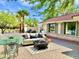 Charming outdoor patio, equipped with ample seating and a decorative fire pit for serene outdoor living at 15602 N 37Th St, Phoenix, AZ 85032