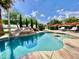 Sparkling pool with a rock waterfall, sun loungers, and lush foliage at 15602 N 37Th St, Phoenix, AZ 85032