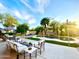 Gorgeous backyard oasis featuring a sparkling pool, lush landscaping, and luxurious patio furniture at 15602 N 37Th St, Phoenix, AZ 85032
