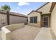 Front yard featuring desert landscaping and a private front patio with paved brick flooring at 15822 W Alpine Ridge Dr, Surprise, AZ 85374