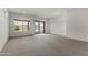 Spacious living room with large window and access to the outside patio at 15822 W Alpine Ridge Dr, Surprise, AZ 85374