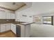 Open concept living area with kitchen bar and large living space filled with natural light at 15822 W Alpine Ridge Dr, Surprise, AZ 85374