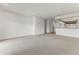 Bright and open living room features carpet and white walls at 15822 W Alpine Ridge Dr, Surprise, AZ 85374