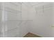 Walk-in closet with lots of shelving for storage at 15822 W Alpine Ridge Dr, Surprise, AZ 85374