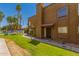 Attractive townhouse exterior features a red tile roof, secure front door, and a well-kept green lawn at 16225 N 30Th St # 11, Phoenix, AZ 85032
