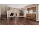 Open living space featuring laminate floors, stairway, and a kitchen with a breakfast bar at 16225 N 30Th St # 11, Phoenix, AZ 85032