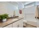 Well-lit bathroom with vanity sink, mirror, and tub/shower combo at 16381 W Weeping Willow Rd, Surprise, AZ 85387