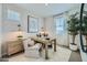 Charming home office with bright light, stylish decor, and an accent wall at 16381 W Weeping Willow Rd, Surprise, AZ 85387