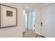 Inviting hallway showcasing modern artwork and a seamless transition into the living spaces at 16722 W Audrey Ln, Surprise, AZ 85387