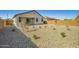 Backyard featuring low-maintenance gravel landscaping, with a covered patio at 16754 W Alameda Rd, Surprise, AZ 85387