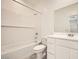 Modern bathroom featuring a tub, shower, toilet, and vanity with double sinks at 16754 W Alameda Rd, Surprise, AZ 85387