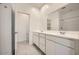 Modern bathroom featuring double sinks and access to the shower at 16754 W Alameda Rd, Surprise, AZ 85387