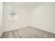 Cozy bedroom features neutral carpet and a bright window at 16754 W Alameda Rd, Surprise, AZ 85387