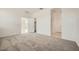 Spacious carpeted bedroom with bright interior door at 16754 W Alameda Rd, Surprise, AZ 85387