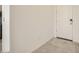 Bright entryway featuring tile flooring, a white front door, and neutral walls at 16754 W Alameda Rd, Surprise, AZ 85387