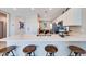 Modern kitchen with a central island, bar stools, and open layout at 16754 W Alameda Rd, Surprise, AZ 85387
