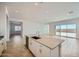 Spacious kitchen island with sink, ample counter space, and an open view to the backyard at 16781 W Bronco Trl, Surprise, AZ 85387