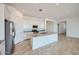 Well-equipped kitchen with white cabinets, an island, and stainless steel appliances at 16781 W Bronco Trl, Surprise, AZ 85387