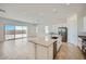 Open-concept kitchen with an island flowing into the living space and a patio at 16781 W Bronco Trl, Surprise, AZ 85387