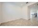 Bright living room featuring tile flooring and an open layout leading to the kitchen at 16781 W Bronco Trl, Surprise, AZ 85387
