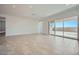 Expansive living area with tiled floors and glass sliding doors leading to the backyard at 16781 W Bronco Trl, Surprise, AZ 85387
