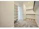 Spacious walk-in closet with built-in shelving and plenty of storage space at 16781 W Bronco Trl, Surprise, AZ 85387