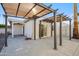 Back patio features a shaded pergola, concrete flooring, and a sliding glass door entrance at 17019 E Calaveras Ave, Fountain Hills, AZ 85268