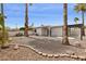 Low-maintenance backyard with gravel landscaping and mature palm trees at 17019 E Calaveras Ave, Fountain Hills, AZ 85268