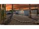 Desert landscaped backyard with palm trees and a covered patio, perfect for outdoor living at 17019 E Calaveras Ave, Fountain Hills, AZ 85268